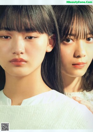 A magazine with three young women posing for a picture.