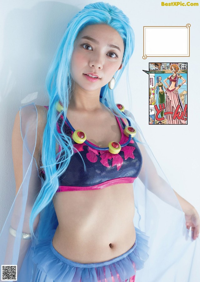 A woman with blue hair wearing a blue and pink outfit.