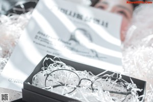 A black box with a picture of a woman in it.