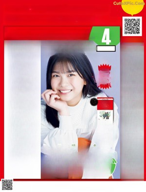 A magazine with a woman in a white shirt on the cover.